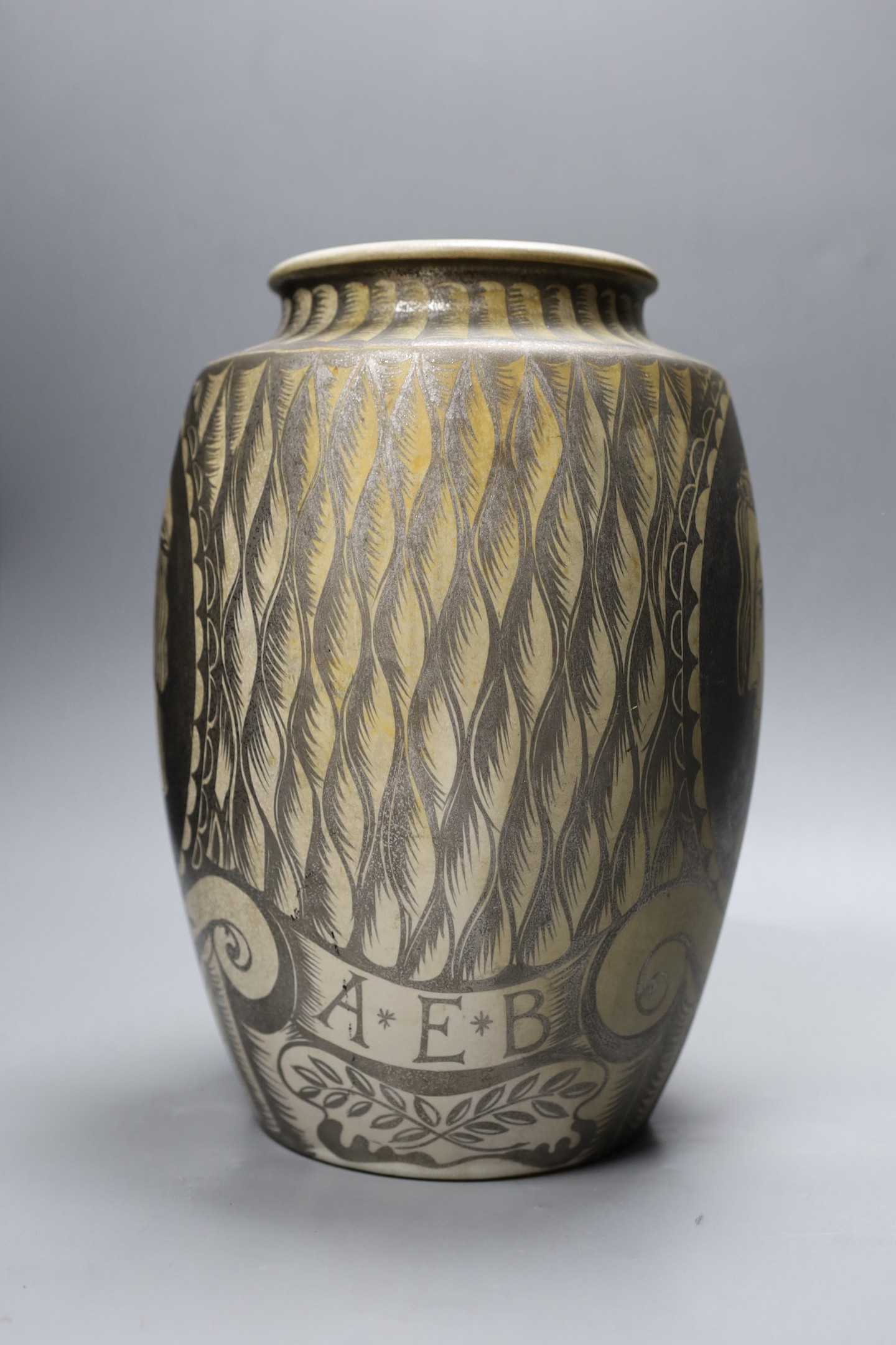 A possibly unique Royal Doulton Lambeth stoneware silver lustre vase, c.1936, painted with Greek style heads on a feather ground, inscribed ‘A*E*B 1936’, impressed marks to base, 30.5 cm high